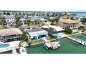 Spectacular aerial view showcasing the property's private dock and waterfront location at 11300 7Th E St, Treasure Island, FL 33706