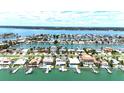 Breathtaking aerial view highlighting the home's location within a prestigious waterfront community at 11300 7Th E St, Treasure Island, FL 33706