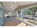 Covered front porch with swing, and neighborhood views at 1918 Overbrook Ave, Clearwater, FL 33755