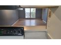 Living room with laminate wood floor and view to outdoors at 2625 State Road 590 # 622, Clearwater, FL 33759
