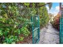 Pathway to beach through lush greenery at 744 Jungle Queen Way, Longboat Key, FL 34228