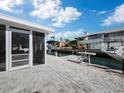 Backyard patio with canal access and boat slips at 744 Jungle Queen Way, Longboat Key, FL 34228