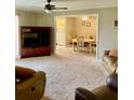 Living room with carpeting, furniture, and view to dining area at 3847 35Th S Way # 108, St Petersburg, FL 33711