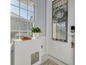 Foyer with stained glass door and tile floor at 4603 Overlook Ne Dr, St Petersburg, FL 33703