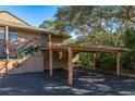 Charming condo building with covered parking and mature trees at 501 Lennox W Rd # 501, Palm Harbor, FL 34683