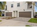 View of attached garages and balconies on modern townhouses at 510 S Albany Ave # 4, Tampa, FL 33606