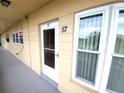 Front door of condo unit number 57 at 2403 Finlandia Ln # 57, Clearwater, FL 33763