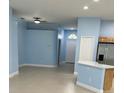 View of the kitchen and entryway, showcasing the open floor plan and tile floors at 8512 Canterbury Lake Blvd, Tampa, FL 33619