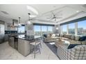 Bright open-concept living space with views, chef's kitchen, and tray ceilings at 15 Avalon St # 704, Clearwater Beach, FL 33767