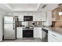 Modern kitchen with stainless steel appliances and granite countertops at 7321 Central Ave # 307, St Petersburg, FL 33710