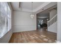 Charming dining area with hardwood floors and a chandelier at 8620 Brookway Cir, Tampa, FL 33635
