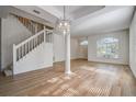 Open living area with hardwood floors, high ceilings, and lots of natural light at 8620 Brookway Cir, Tampa, FL 33635