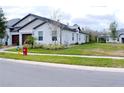 Street view of a single-Gathering home with a manicured lawn at 16851 Forge Surf St, Land O Lakes, FL 34638