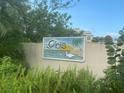 Community entrance sign featuring the name 'ibis' and a coastal scene at 3020 Sheppards Crook Ct, Holiday, FL 34691
