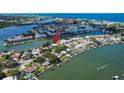 Aerial view of waterfront neighborhood with docks, boats, and beautiful water views at 341 Bahia Vista Dr, Indian Rocks Beach, FL 33785