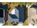 Aerial view of a house's roof and surrounding yards at 4401 Plumosa St, Spring Hill, FL 34607