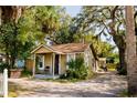 Exterior view of the home showcasing its cozy curb appeal and driveway at 8303 N Mulberry St, Tampa, FL 33604