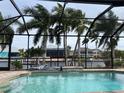 Relaxing screened-in pool area with canal views at 8384 Antwerp Cir, Port Charlotte, FL 33981