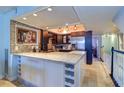 Modern kitchen with granite countertops and stainless steel appliances at 9487 Tara Cay Ct, Seminole, FL 33776