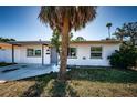 Charming single-story home with covered entryway and well-maintained landscaping at 1536 77Th N Ave, St Petersburg, FL 33702