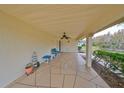Covered patio with seating, decorative plants, and view of the water at 2003 Halmrock Pl, Sun City Center, FL 33573