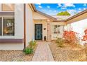 Front door entrance with brick columns and landscaping at 7497 Heather Walk Dr, Weeki Wachee, FL 34613