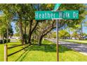 Street sign for Heather Walk Dr, showing neighborhood setting at 7497 Heather Walk Dr, Weeki Wachee, FL 34613