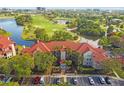 Community with a golf course and lots of trees and water features at 2400 Feather Sound Dr # 515, Clearwater, FL 33762