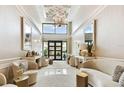 Elegant lobby with high ceilings, stylish seating area, and double doors leading to another area at 4 Belleview Blvd # 801, Belleair, FL 33756