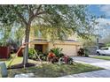 Two-story house with a large tree and manicured lawn at 9703 33Rd E Ave, Palmetto, FL 34221