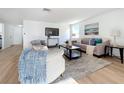Spacious living room with hardwood floors and a cozy seating area at 2460 Terry Ln, Sarasota, FL 34231