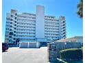 Front exterior of a high-rise building with private entrance and parking at 7000 Beach Plz # 706, St Pete Beach, FL 33706