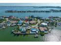 Aerial shot of waterfront property with a private dock and stunning bay views from this coastal community at 819 59Th Ave, St Pete Beach, FL 33706