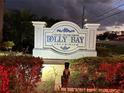 Dolly Bay Condominium sign at entrance with holiday decorations at 2533 Dolly Bay Dr # 101, Palm Harbor, FL 34684