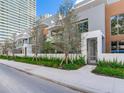 Modern home with a gray metal gate and nicely landscaped walkway at 3020 W Santiago St # 4, Tampa, FL 33629