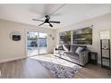 Gathering room with sliding doors opening to a view of the pool at 490 82Nd Ave, St Pete Beach, FL 33706