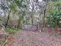 Gated entrance to secluded property at 5960 Tower Rd, Land O Lakes, FL 34638