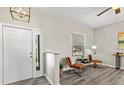 Inviting living room featuring modern light fixture, neutral walls, and stylish seating area at 11351 Callaway Pond Dr, Riverview, FL 33579
