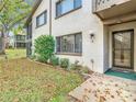 Condo building exterior with entrance and landscaping at 12914 Fairway Dr # A, Hudson, FL 34667