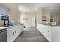 Modern kitchen featuring white cabinets, stainless steel appliances, and an island at 13346 Carter Ave, Port Charlotte, FL 33981