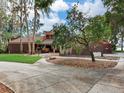 Brick house front with circular driveway at 18120 Wayne Rd, Odessa, FL 33556