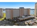 Aerial view of a residential building with covered parking and nearby water at 5130 Brittany S Dr # 505, St Petersburg, FL 33715