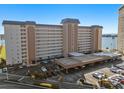 Aerial perspective of a residential building with parking and a waterfront view at 5130 Brittany S Dr # 505, St Petersburg, FL 33715