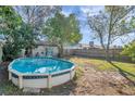 Above ground pool in backyard with surrounding trees at 1211 Coolridge Dr, Brandon, FL 33511