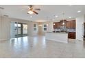 Open kitchen with island, modern cabinetry, and tile flooring at 442 Bahama Grande Blvd, Apollo Beach, FL 33572