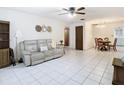 Spacious living room with tile flooring and an adjacent dining area at 5316 Buttonwood Dr, New Port Richey, FL 34652