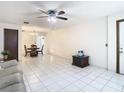 Open-concept living and dining area with tiled floors at 5316 Buttonwood Dr, New Port Richey, FL 34652