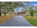 Newly paved driveway leading to a charming ranch home at 5749 Southernview Dr, Zephyrhills, FL 33541