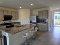 Modern kitchen with stainless steel appliances and granite countertops at 8379 Ender Hills Dr, Wesley Chapel, FL 33545