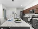 Modern kitchen with marble countertops and stainless steel appliances at 1716 22Nd N Ave, St Petersburg, FL 33713